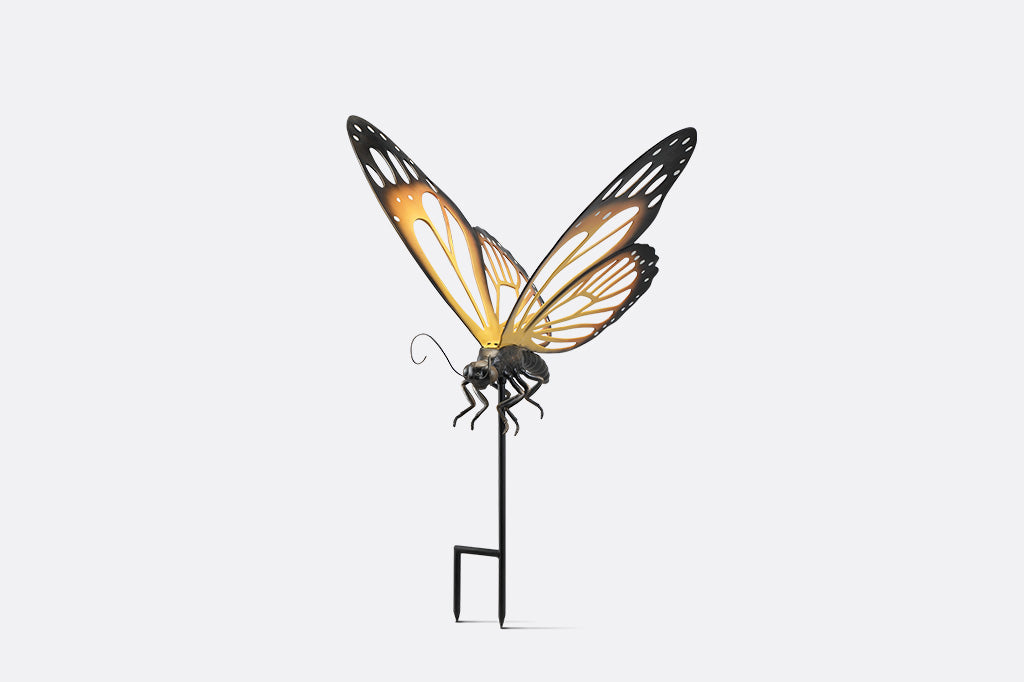 A garden stake of a monarch butterfly.