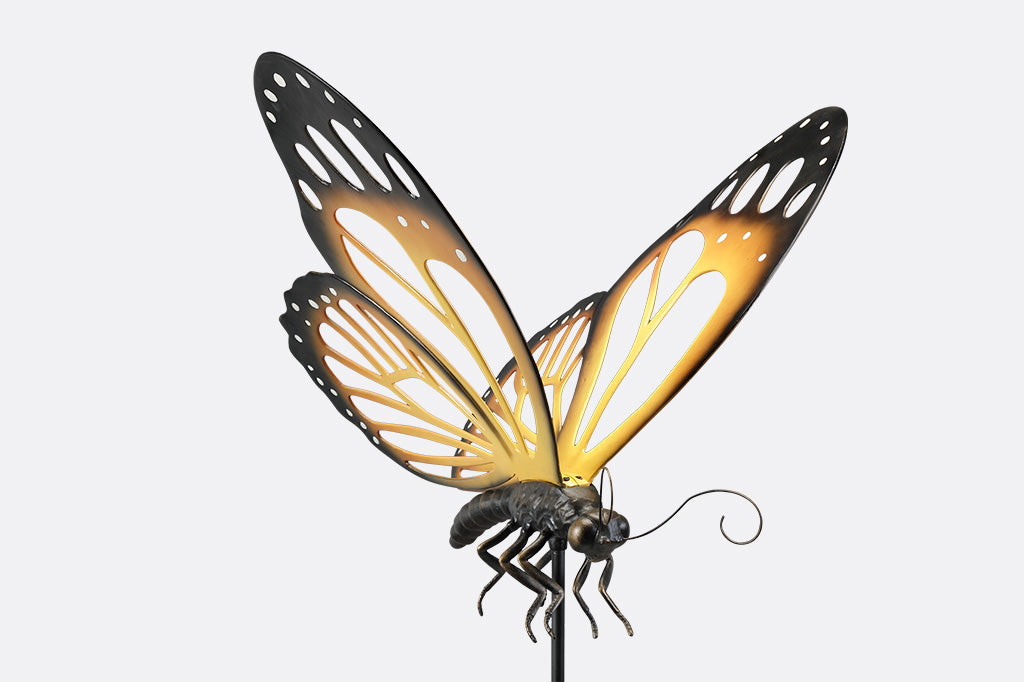 A garden stake of a monarch butterfly.