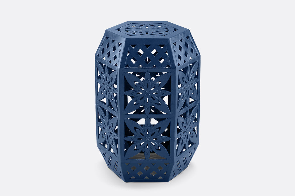 Blue hexagonal garden stool with intricate lattice design.