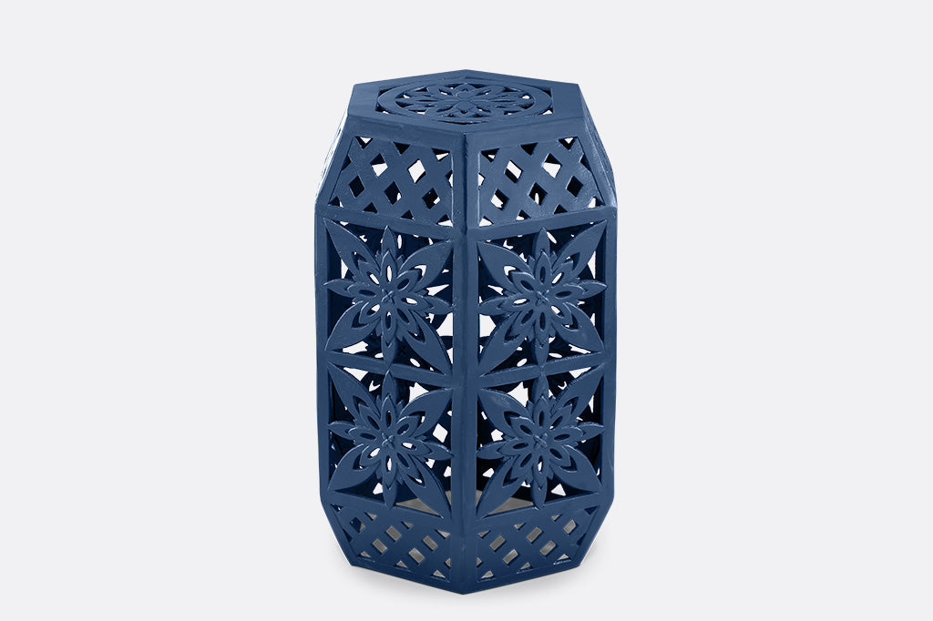 Blue hexagonal garden stool with intricate lattice design.