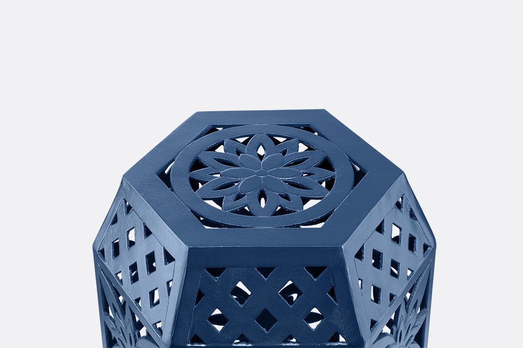 Blue hexagonal garden stool with intricate lattice design.