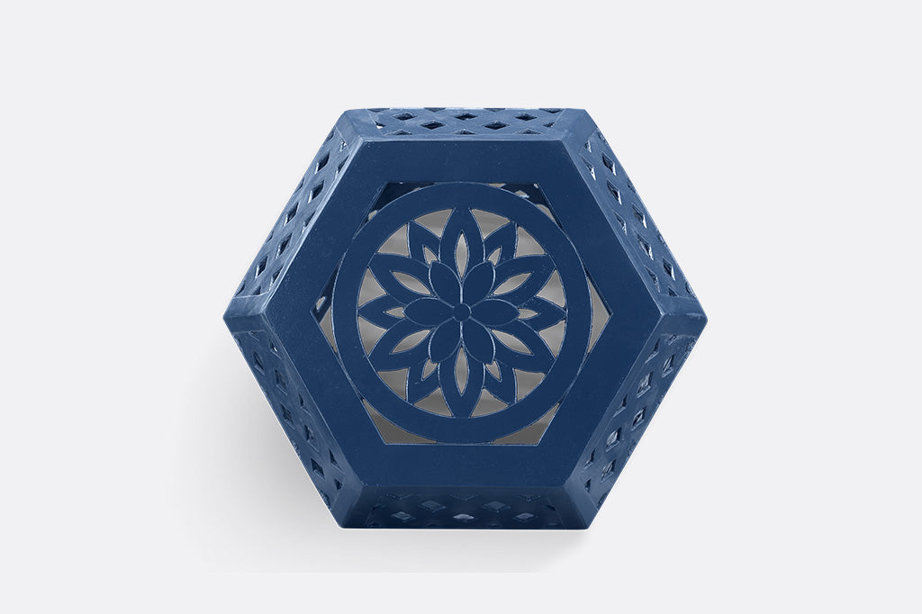 Blue hexagonal garden stool with intricate lattice design.