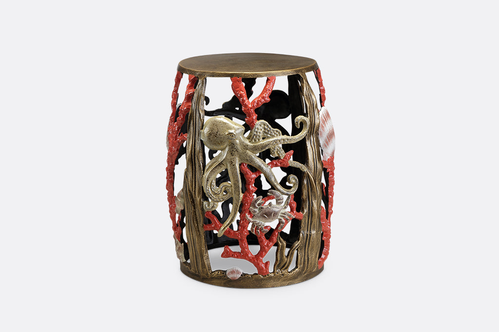 Garden stool featuring pink corals, an octopus, seashells, and crabs.