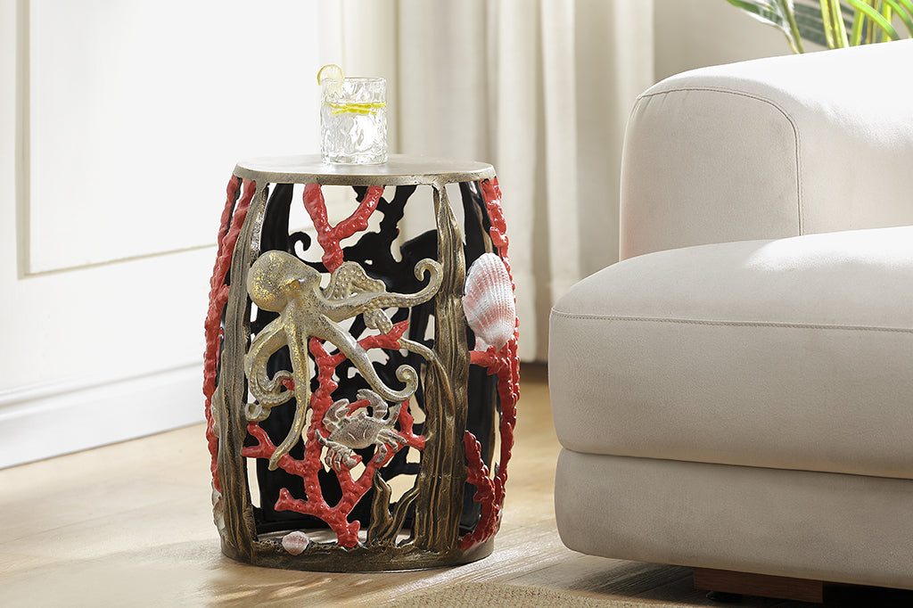 Garden stool featuring pink corals, an octopus, seashells, and crabs.