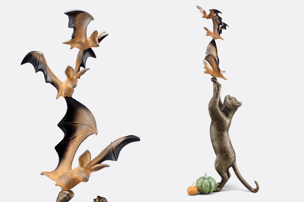 close up of orange and black bats in flight