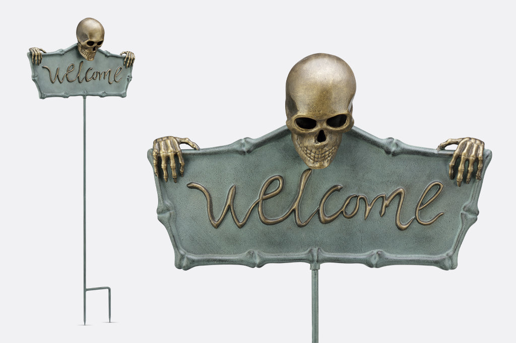 cast metal welcome sign with stake, 3-d skeleton holding sign