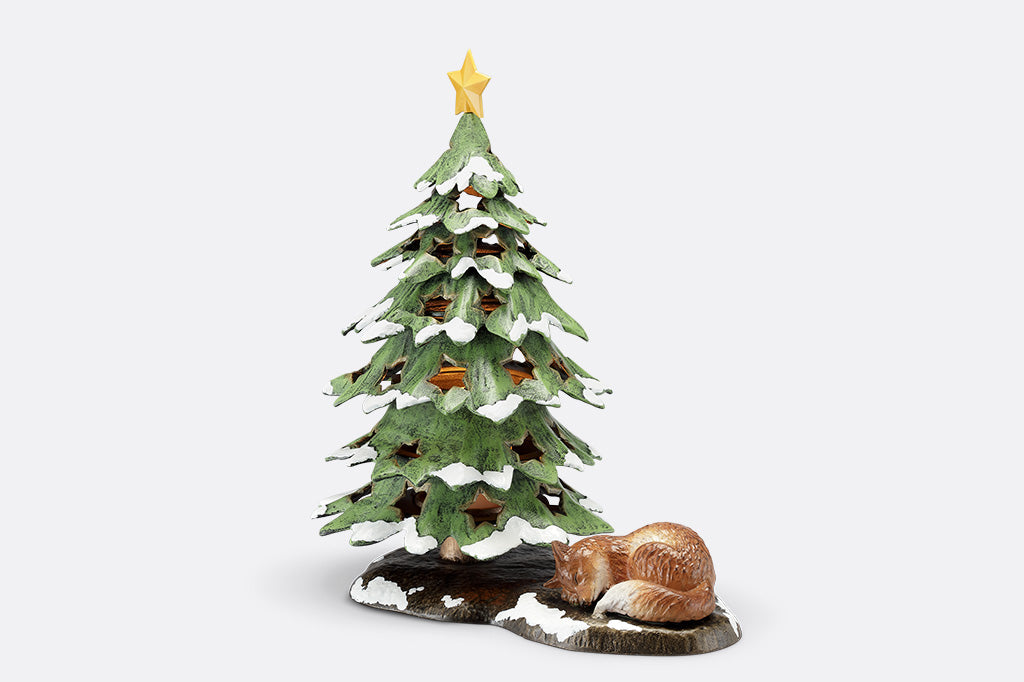 Decorative Christmas tree figurine with a star on top and a fox at its base on a white background
