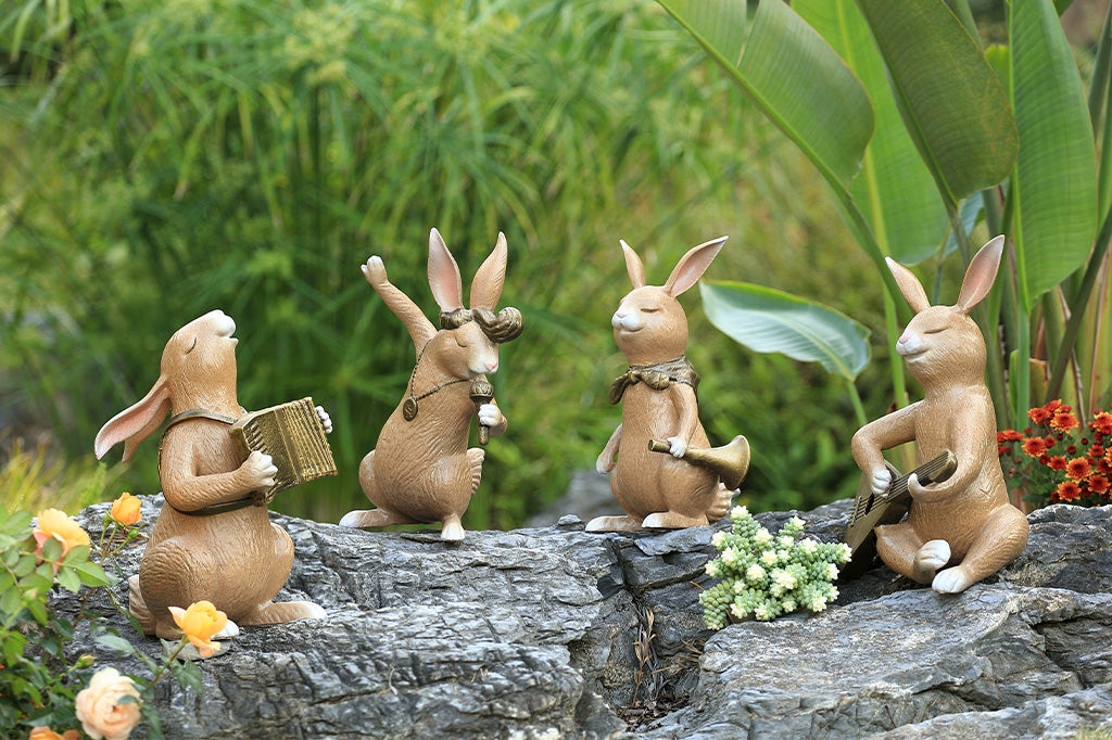 A set of four bunnies performing with musical instruments.