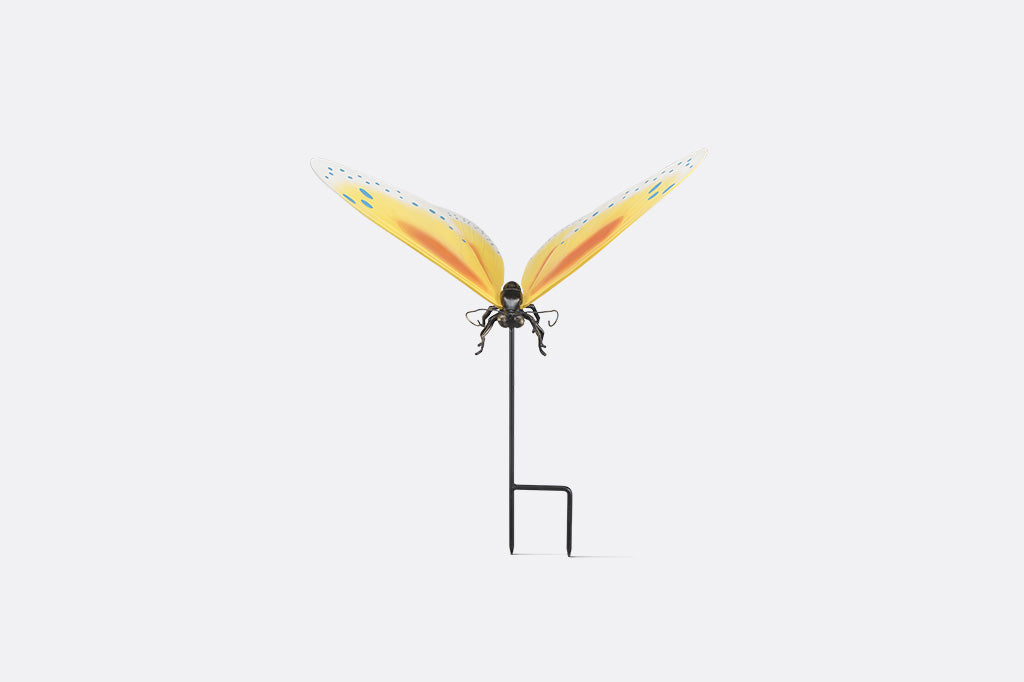 The front view of a Yellow and orange butterfly garden stake with blue dots on white background