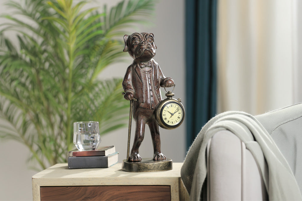 Bronze statue of a dog with a clock on a table in a living room setting
