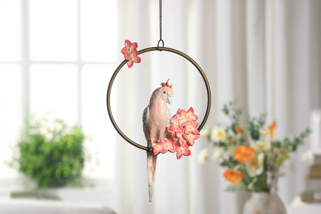 Decorative hanging sculpture with a bird and flowers