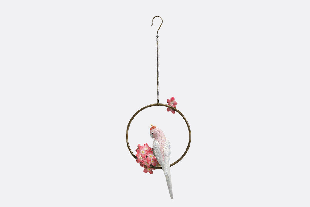 Decorative hanging sculpture with a bird and flowers