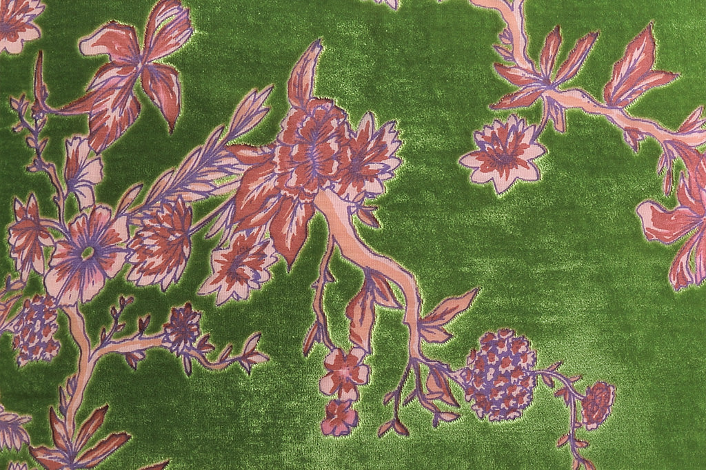 Green pillow with pink floral pattern