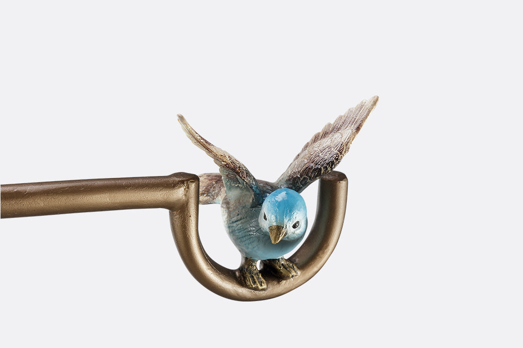 A flag stand with two birds