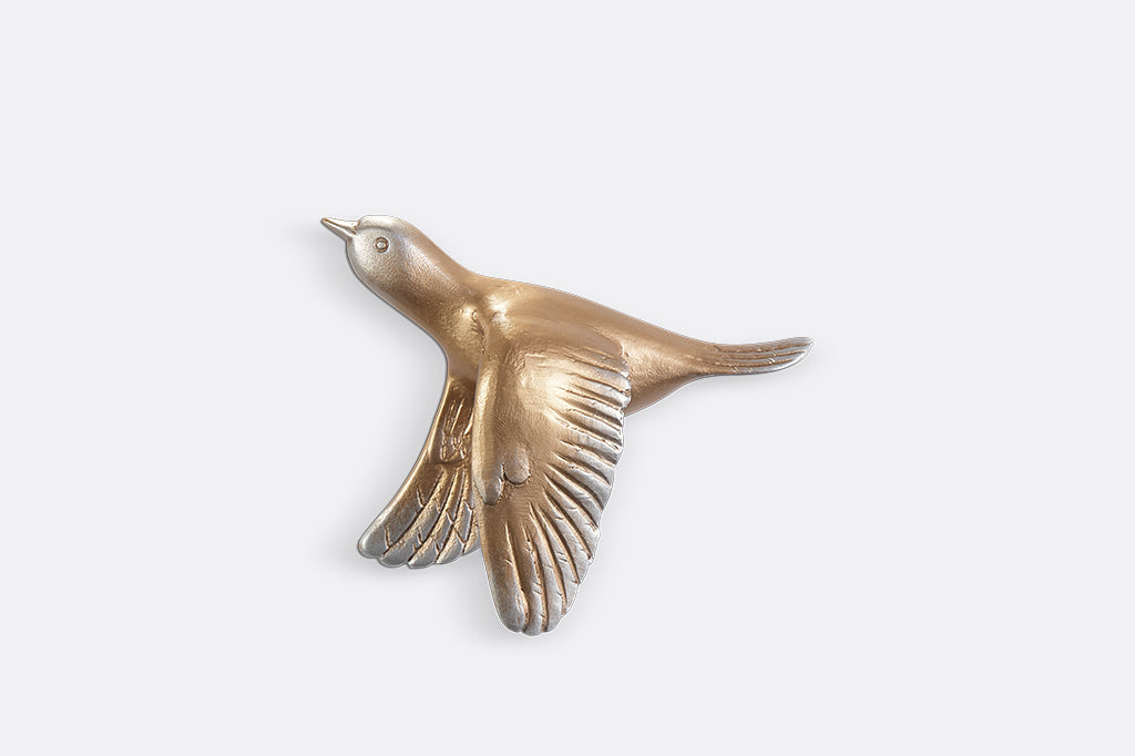 A set of 5 gold birds posed in flight.