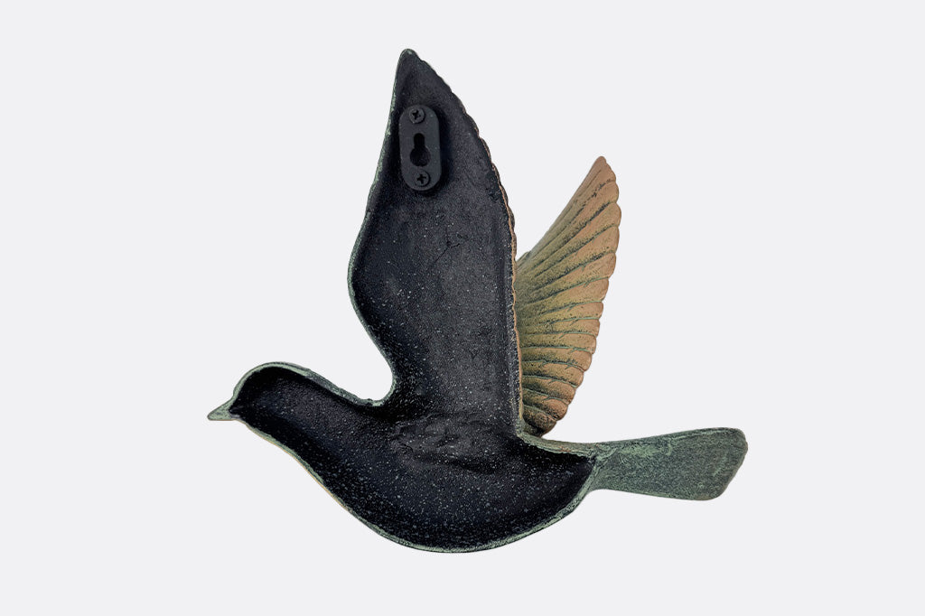 The back of a bird wall art sculpture.