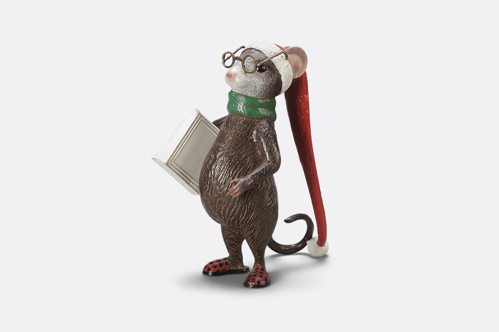 A mouse with glasses, a long night cap, slippers, a green scarf, and a book called "The Art of Dozing."