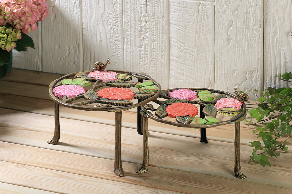 A set of 2 plant stands featuring details of pink hydrangeas, leaves, snails, and butterflies.