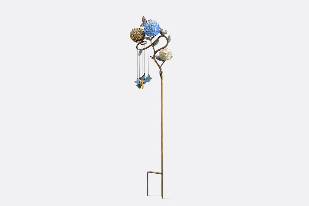 Decorative garden stake with butterflies shot on white background, side view