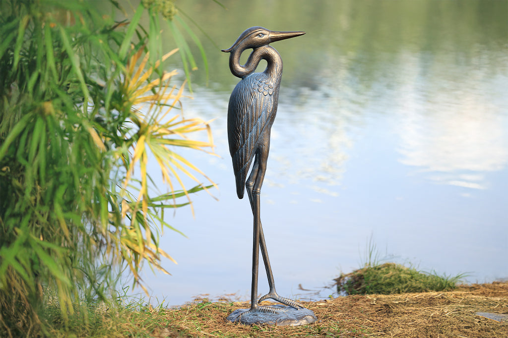 A sculpture of a heron with an arched neck.