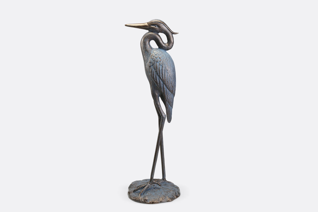 A sculpture of a heron with an arched neck.