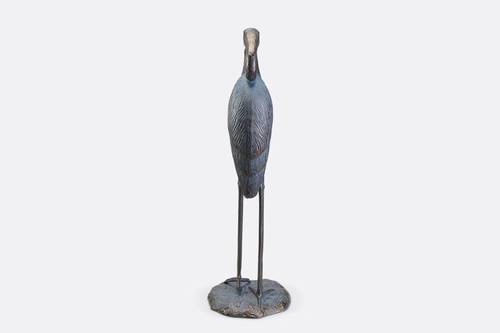 A sculpture of a heron with an arched neck.