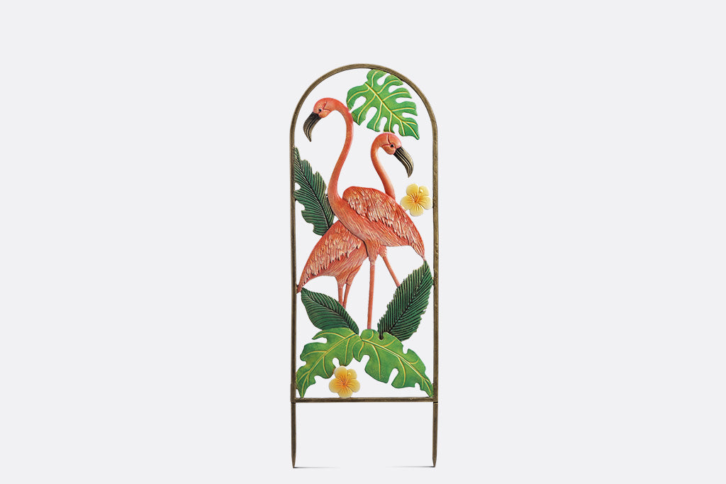 Decorative metal garden art with flamingo design on a white background