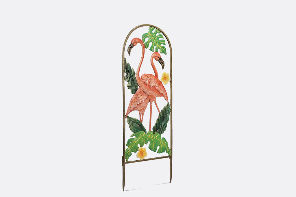 Decorative metal garden art with flamingo design on a white background