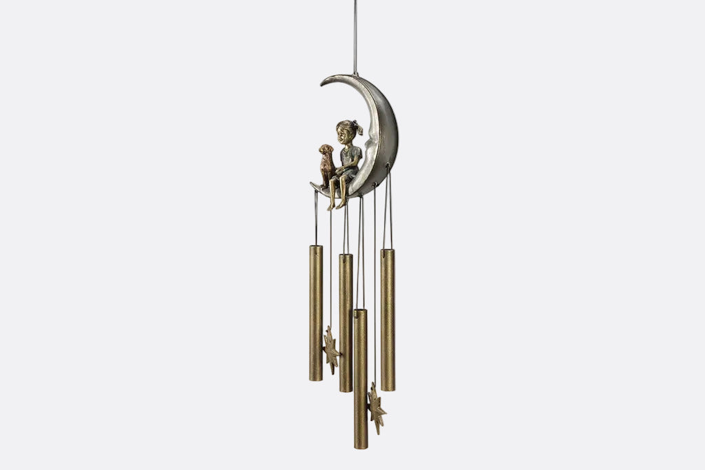 windchime garden decor with girl and pet dog sitting on a crescent moon. bronze tube chimes and star pendants