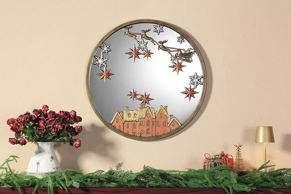 A round mirror with details of Santa and his sleigh being pulled by reindeer across a sky of stars and over rooftops.