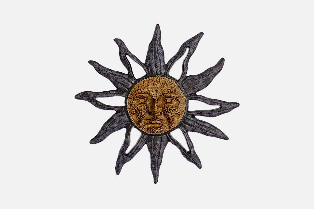 sun with face in center with waving rays: cast metal wall plaque