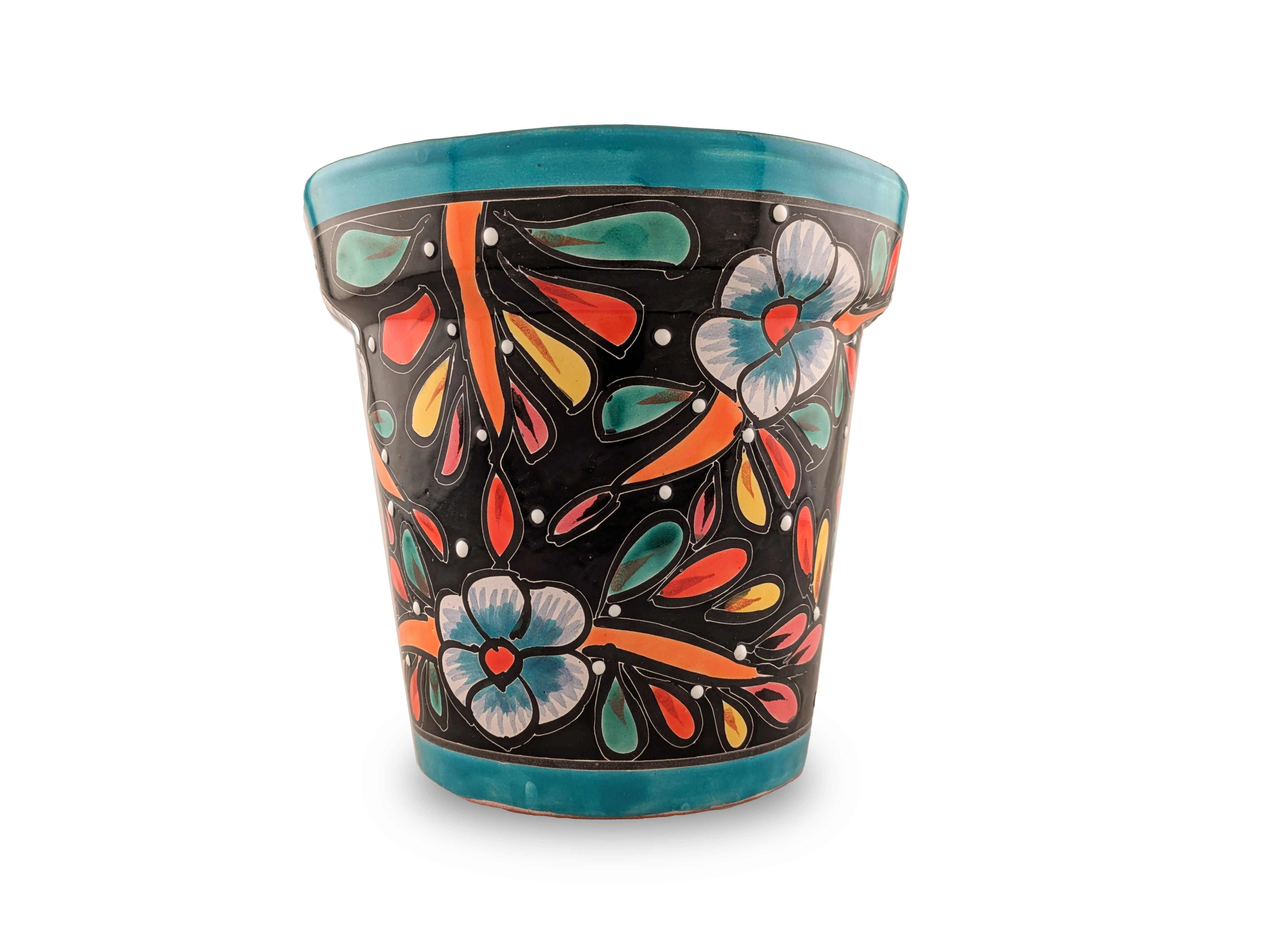 Ceramic planter with colorful floral design on a white background