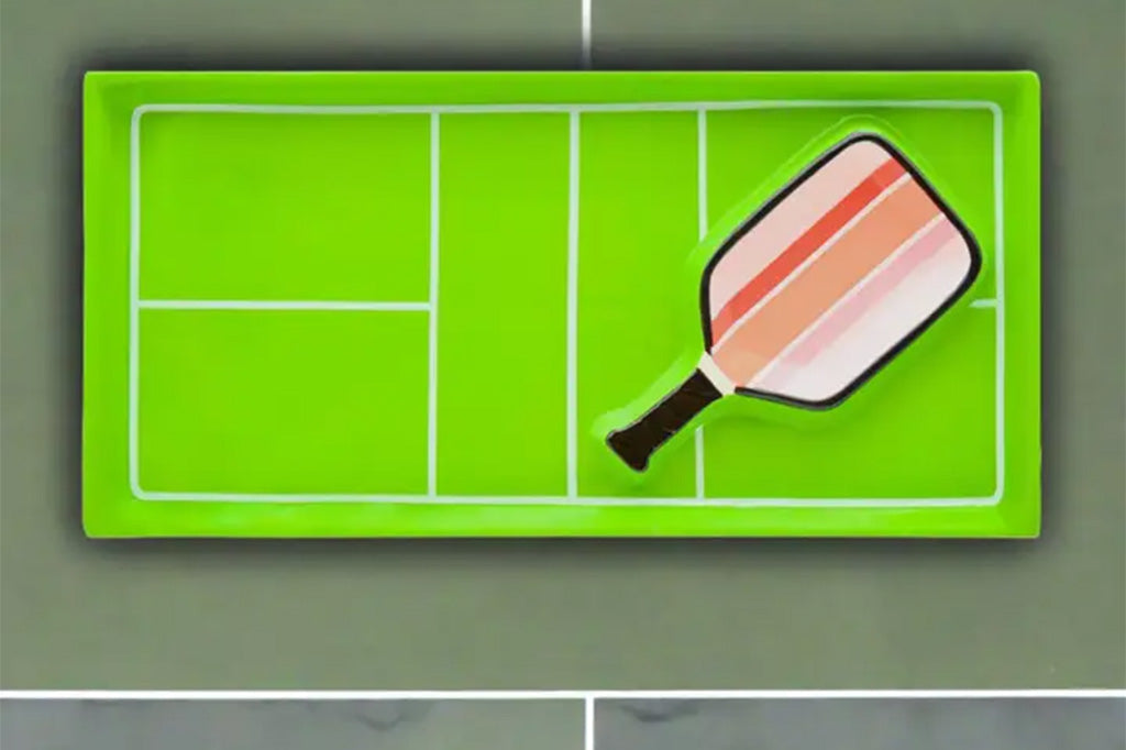 pickleball themed ceramic platter with embedded paddle-shaped dip bowl