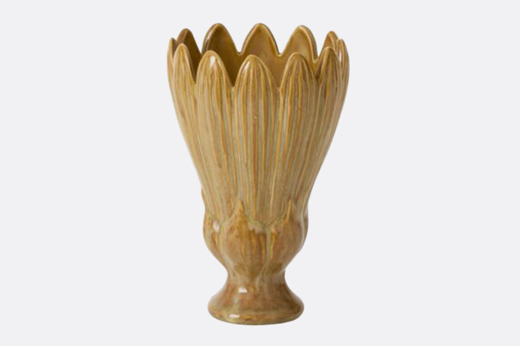 Decorative blossom shaped vase with a textured design on a white background