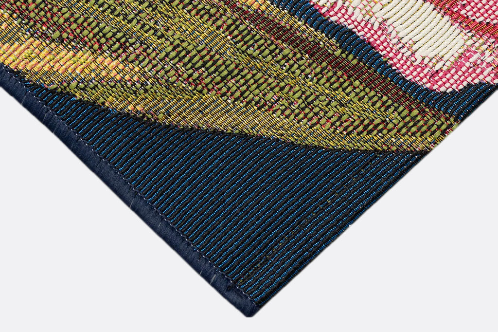 Close-up of a textured woven rug fabric with a colorful pattern
