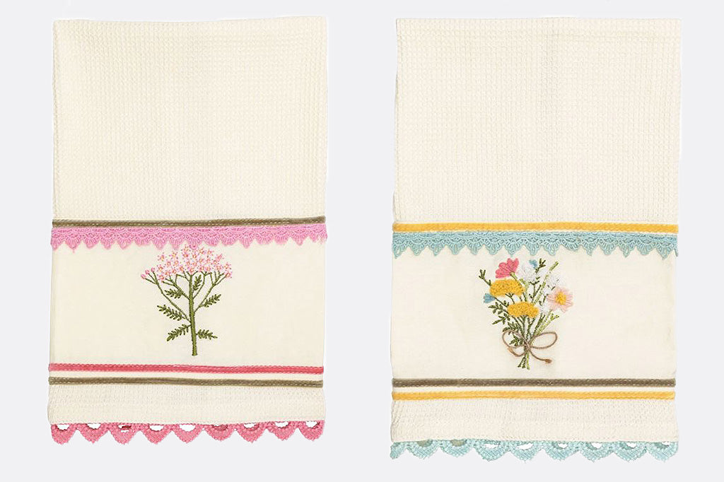 A set of four cotton dishtowels featuring spring flowers in vibrant pastel colors.