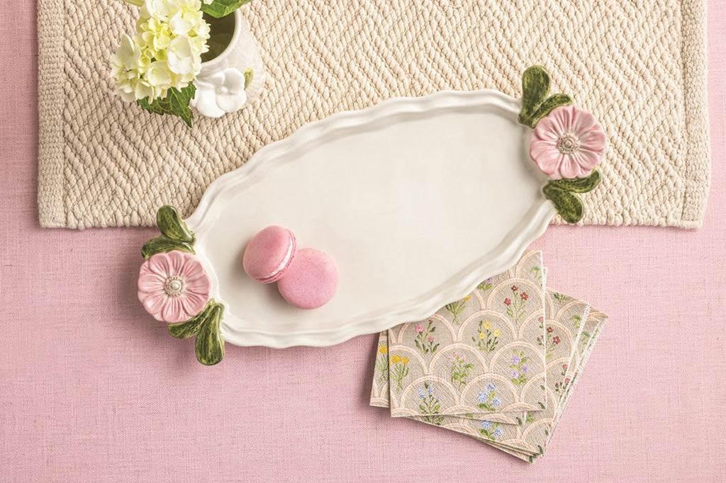 A tray with pink flowers and a set of matching napkins.