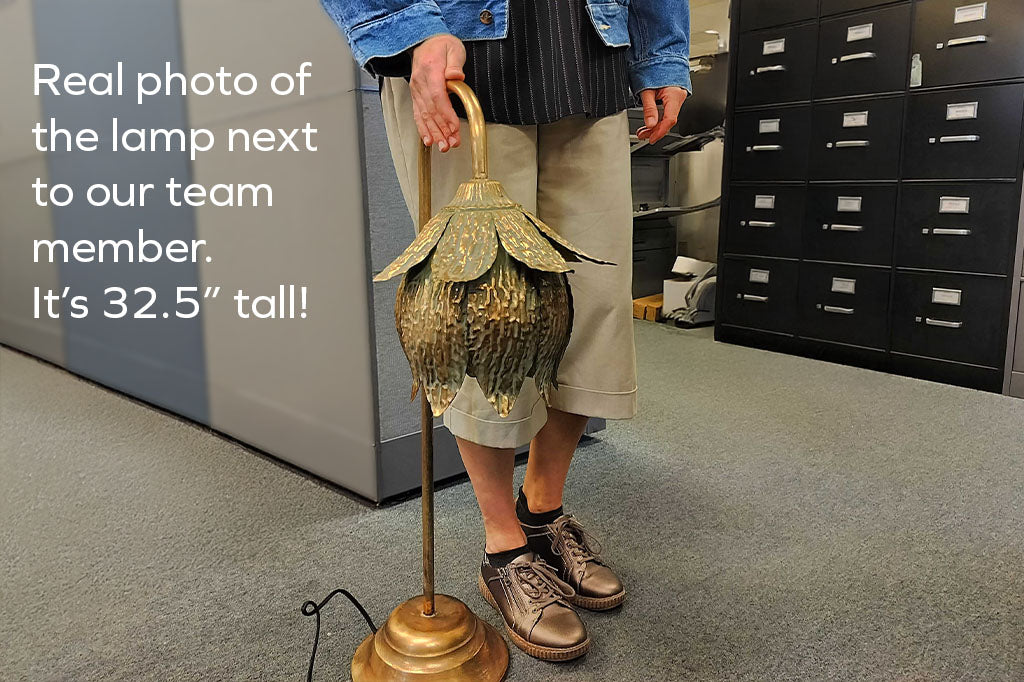 metal tulip curved tulip lamp next to adult woman showing the height of 32.5", her hand is resting on top of lamp