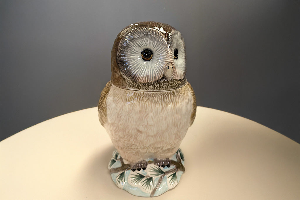 Ceramic owl cookie jar shown on table