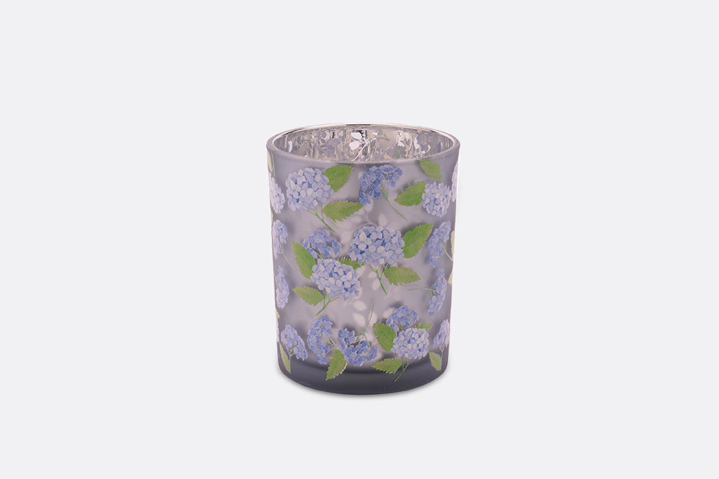 Two purple candleholders with a hydrangea flower design.