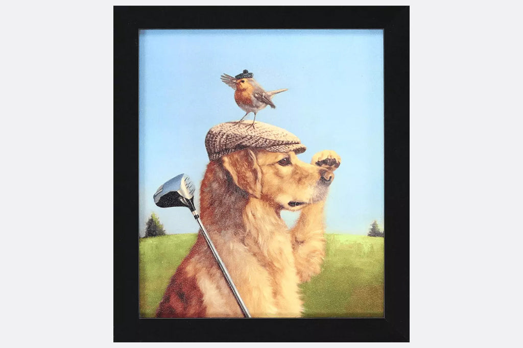 Framed artwork of a dog with a golf club and a bird on its head.