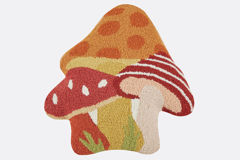 mushroom shaped pillow, cluster of three mushrooms in the colors of orange, red, yellow, and white.