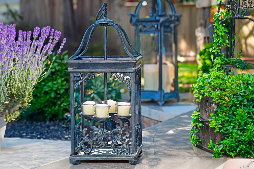 Rouleau Votive Lantern shown outside on a patio 