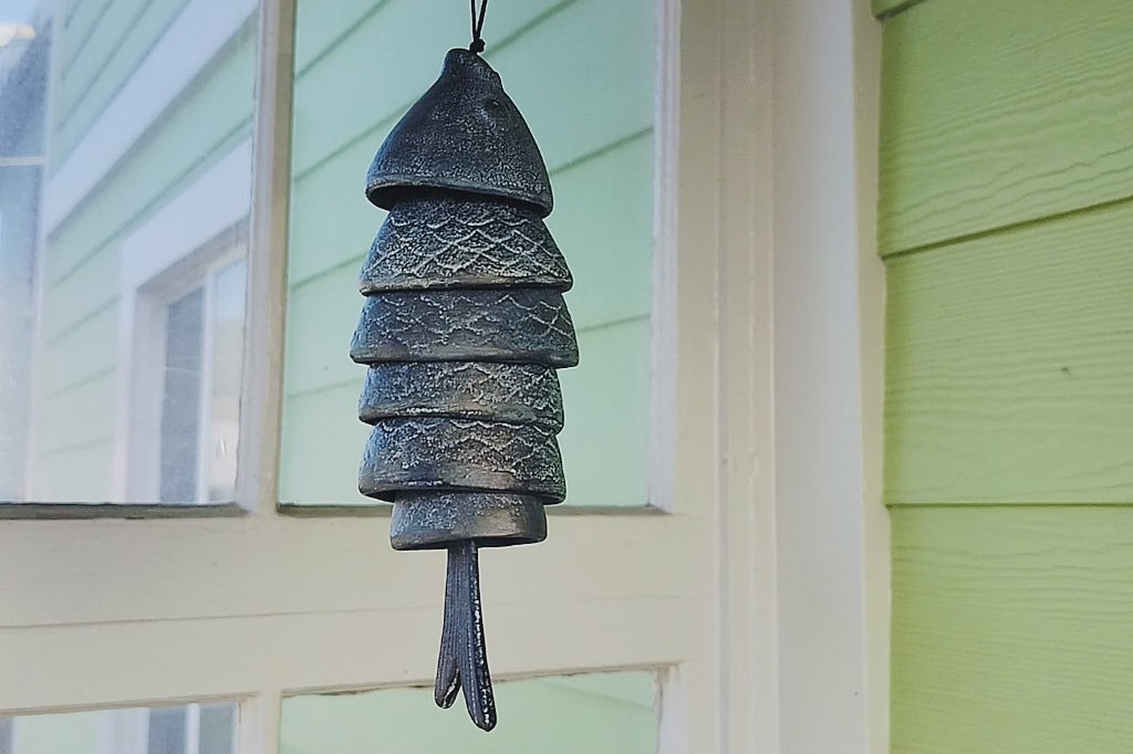 Fish Wind Art chime being shaken to show how it moves when hanging from a porch