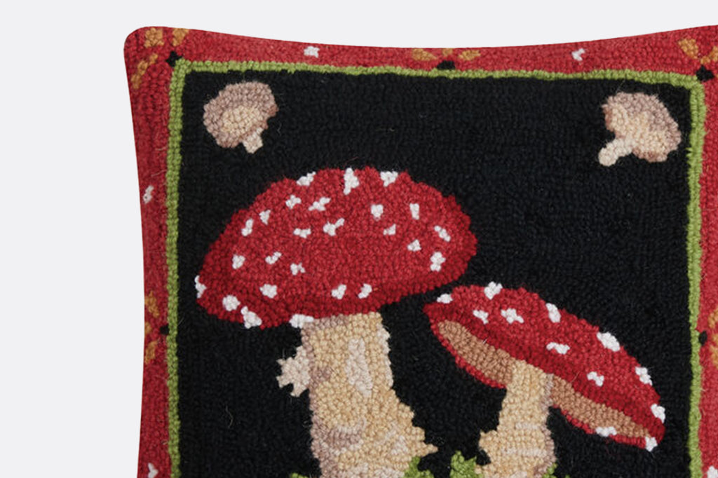 detailed view of tufted red mushroom pillow