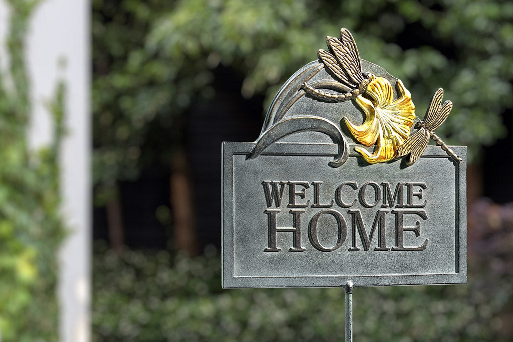 Welcome Home cast metal garden sign with dragonfly and lily embellishments