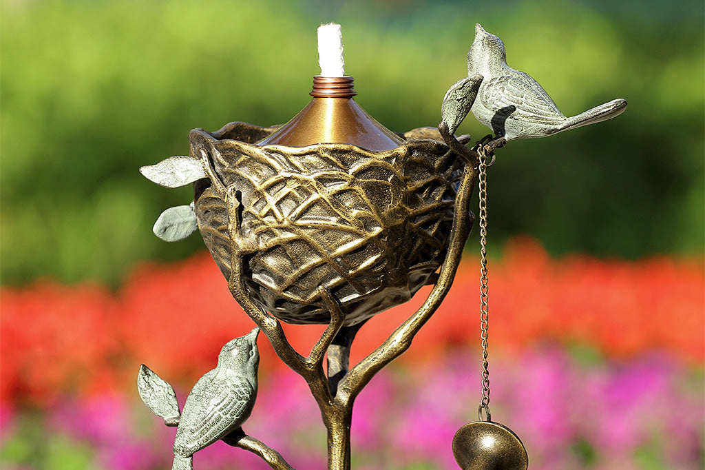 Close up view of Bird’s Nest Oil Torch in a flower garden