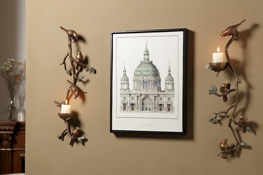Pair of cast metal bird and nest wall sconces, holds two votive candles.
