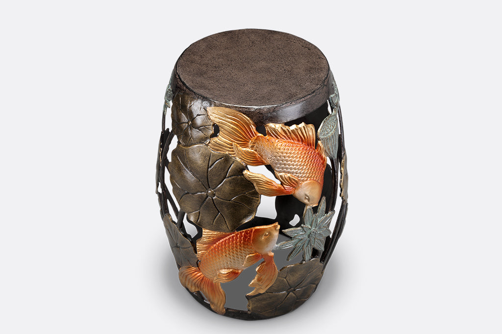 Cast Metal koi fish and water lily garden/ accent stool. golden orange koi surrounded by bronze water lily motifs. 