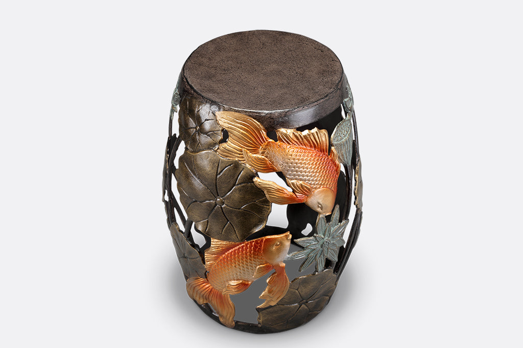 Cast Metal koi fish and water lily garden/ accent stool. golden orange koi surrounded by bronze water lily motifs.